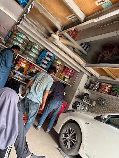 Naizi Wheel Alignment and Balancing Tyre Shop — verified car workshop in Federal B Area, Karachi, Pakistan
