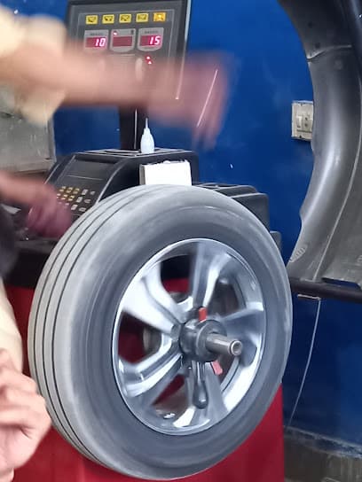 Al Qamar Computerized Wheel Alignment and Balancing — verified car workshop in Johar Town, Lahore, Pakistan